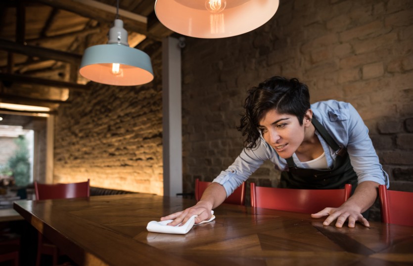 Waitress cleaning a table at a restaurant Weinberger Blog